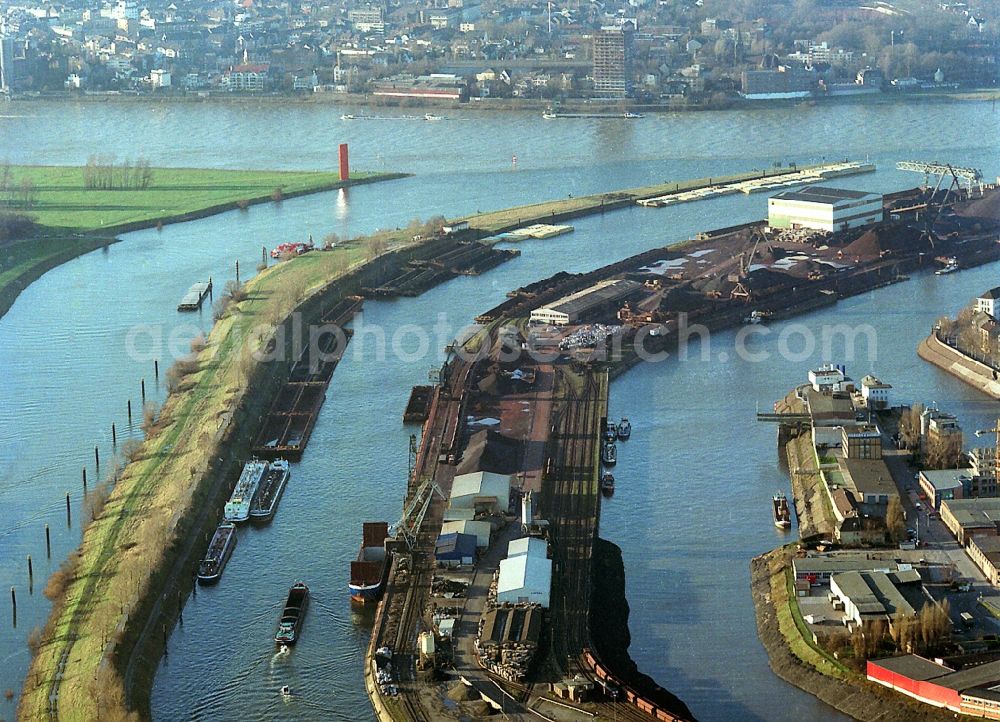 Aerial photograph Duisburg - River Ruhr and Rhine at Ruhrort harbor in Duisburg in North Rhine-Westphalia. They are considered the largest inland port in Europe. In image dock and harbor installations of Ruhrorter port