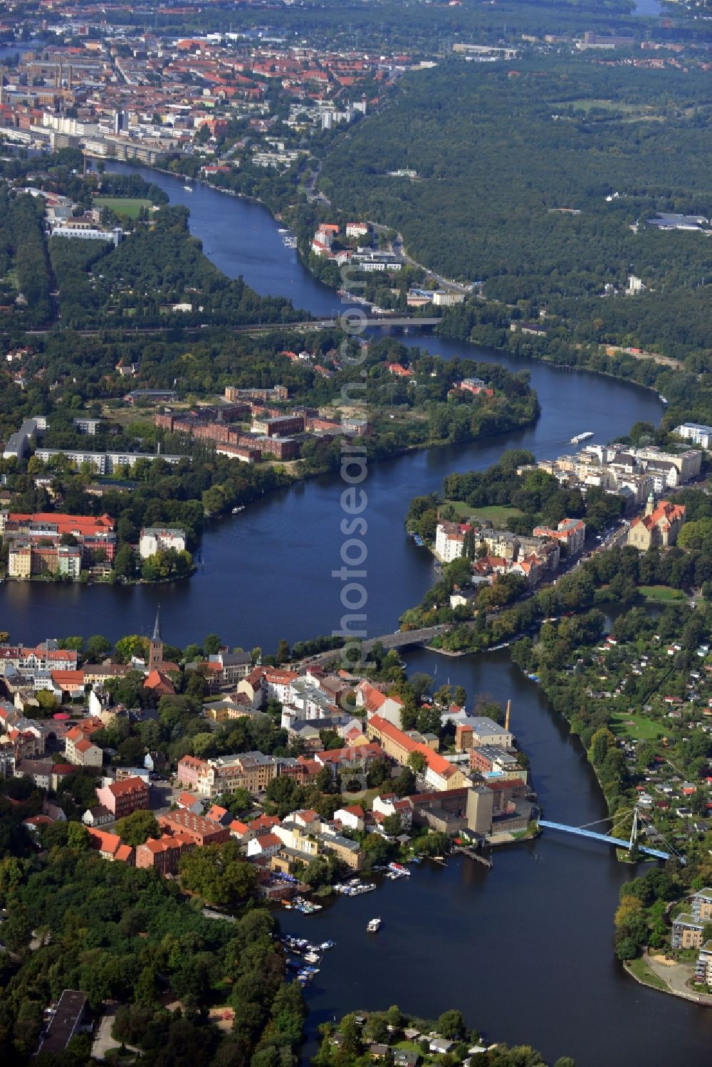 Berlin from above - The river Dahme enters the mouth of the river Spree in the Köpenick district of Berlin. View overlooking the Wuhlheide and Oberschöneweide. Visible are the ruins of the former industrial cleaning factory Rewatex which is in the planning area of the residential Wasserstadt Spindlersfeld