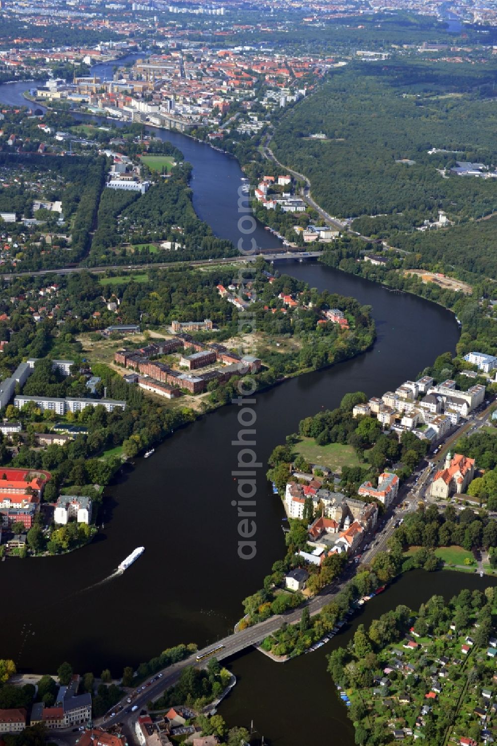 Aerial image Berlin - The river Dahme enters the mouth of the river Spree in the Köpenick district of Berlin. View overlooking the Wuhlheide and Oberschöneweide. Visible are the ruins of the former industrial cleaning factory Rewatex which is in the planning area of the residential Wasserstadt Spindlersfeld