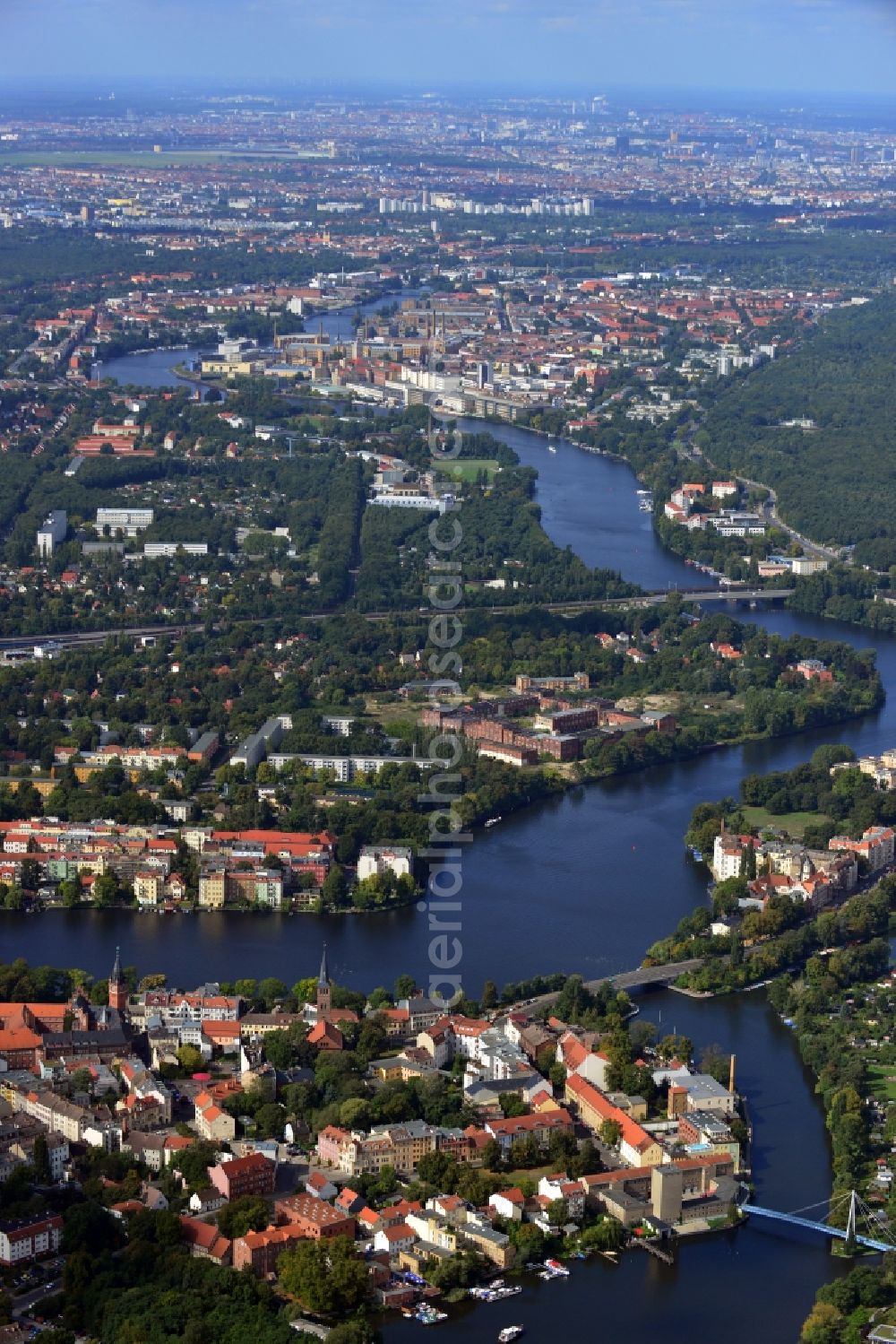 Berlin from the bird's eye view: The river Dahme enters the mouth of the river Spree in the Köpenick district of Berlin. Visible are the ruins of the former industrial cleaning factory Rewatex which is in the planning area of the residential Wasserstadt Spindlersfeld