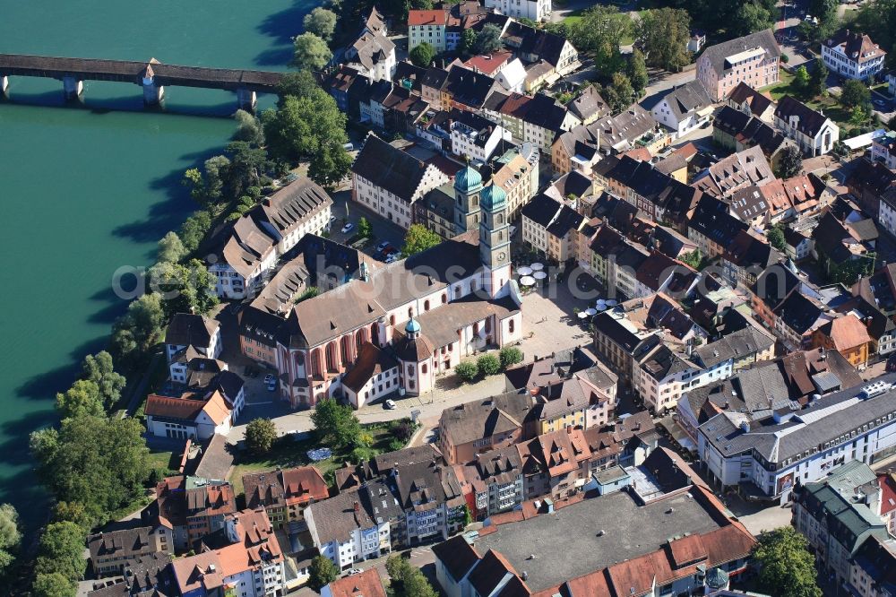 Bad Säckingen from the bird's eye view: Church building Muenster St. Fridolin in the Old Town- center of Bad Saeckingen in the state Baden-Wuerttemberg. The historic wooden bridge over the Rhine links Germany with Switzerland