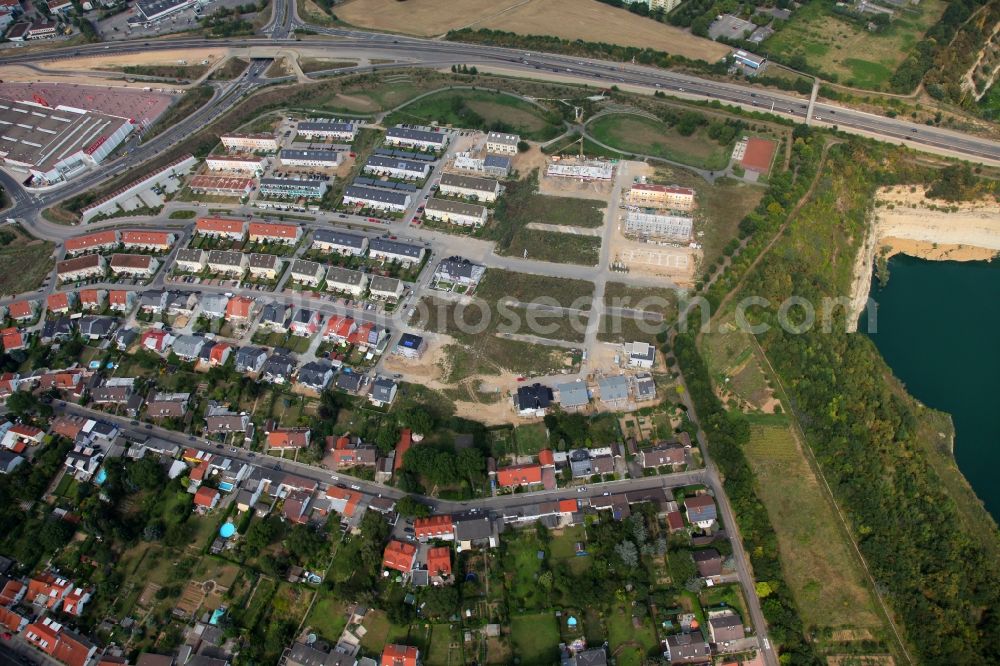 Mainz from the bird's eye view: Modern housing estate with building sites for the construction of another family homes. The residential area is located in the district Weisenau in Mainz in Rhineland-Palatinate