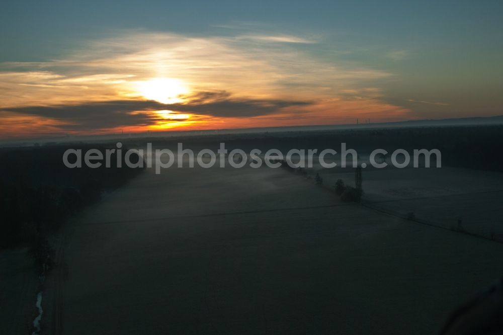 Minfeld from above - Sunrise haze at structures of a field landscape Otterbachtal in Minfeld in the state Rhineland-Palatinate