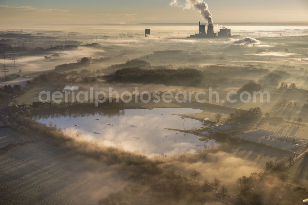 Aerial photograph Hamm - Morning mist over the lip and the meadows of the Lippeauen at sunrise on a former nuclear power plant, today THTR - RWE coal power plant of RWE in Hamm in North Rhine-Westphalia