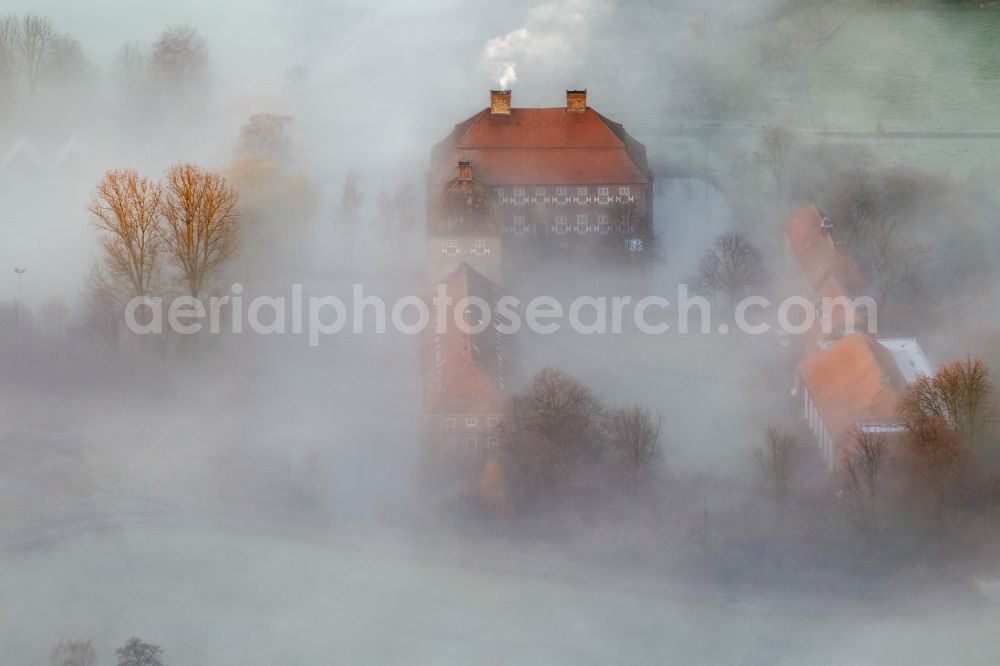 Aerial image Hamm - Morning mist over the lip and the meadows of the Lippeauen at sunrise on Oberwerries Castle in Hamm in North Rhine-Westphalia