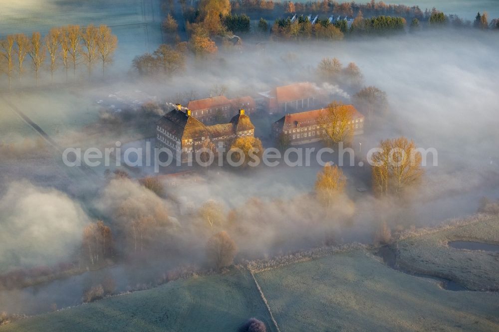 Aerial image Hamm - Morning mist over the lip and the meadows of the Lippeauen at sunrise on Oberwerries Castle in Hamm in North Rhine-Westphalia