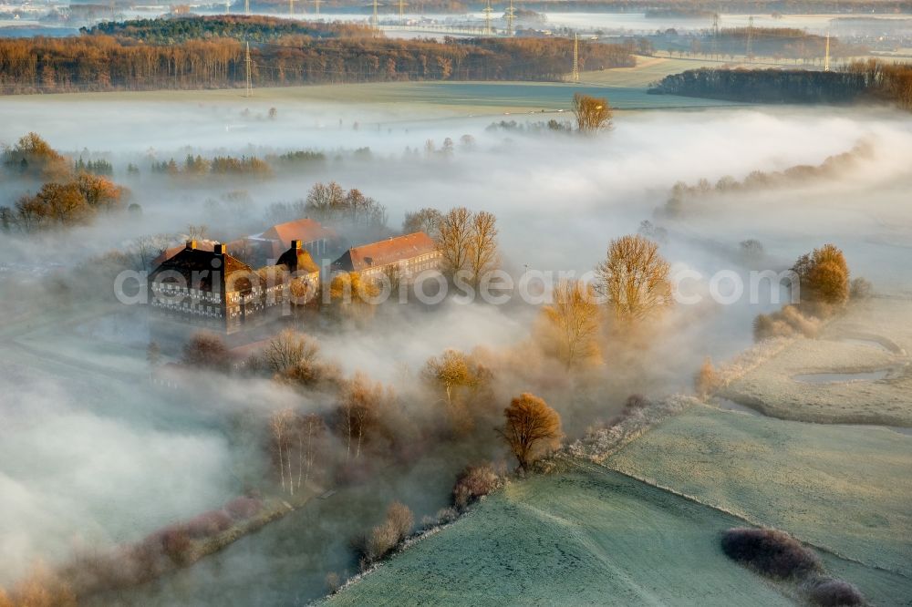 Aerial image Hamm - Morning mist over the lip and the meadows of the Lippeauen at sunrise on Oberwerries Castle in Hamm in North Rhine-Westphalia