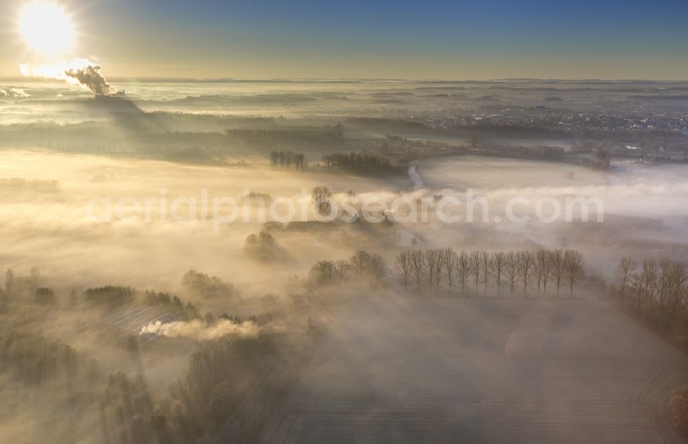 Aerial image Hamm - Morning mist over the lip and the meadows of the Lippeauen at sunrise on Oberwerries Castle in Hamm in North Rhine-Westphalia