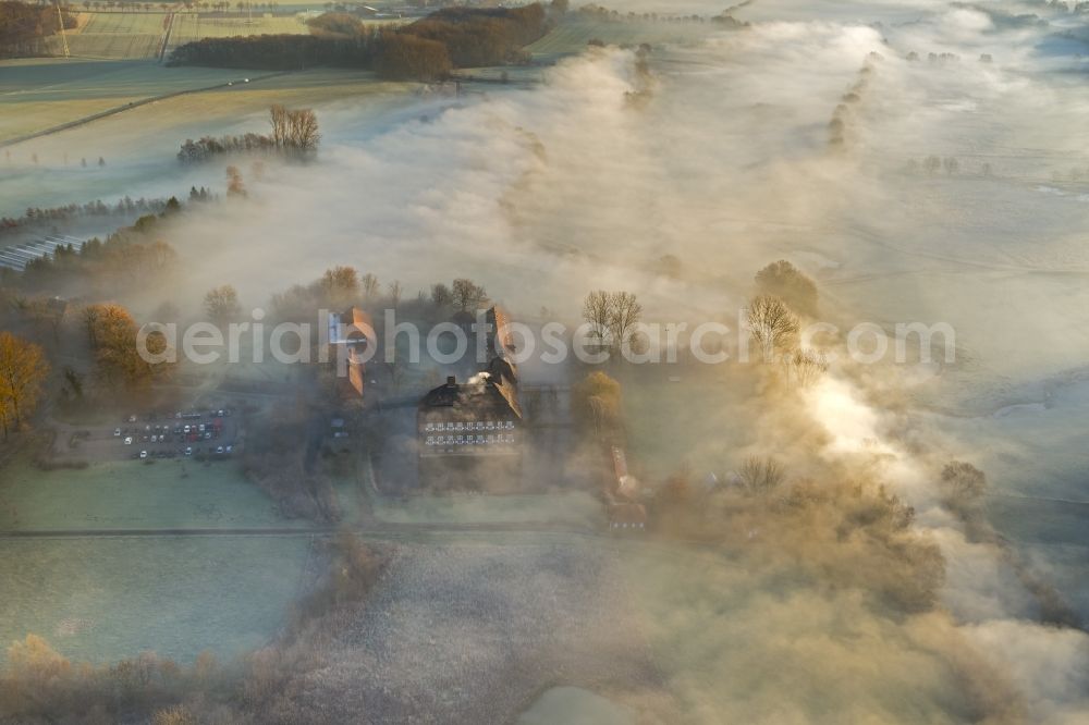 Aerial photograph Hamm - Morning mist over the lip and the meadows of the Lippeauen at sunrise on Oberwerries Castle in Hamm in North Rhine-Westphalia