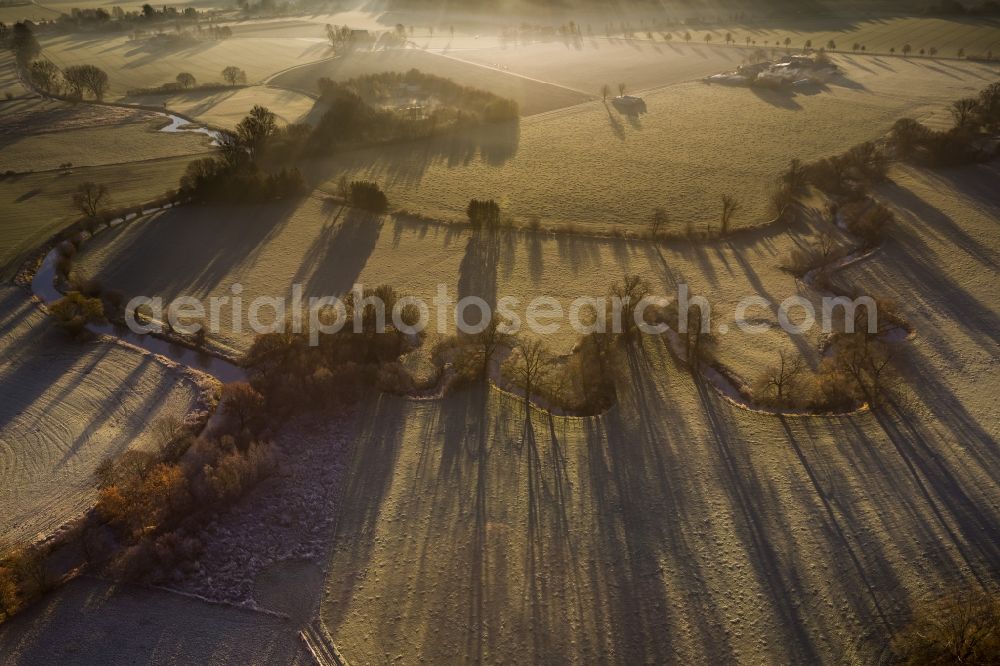 Hamm from the bird's eye view: Morning fog over the course of the river Ahse to the restoration sites and the meadows of the Lippeauen at sunrise in Hamm in North Rhine-Westphalia