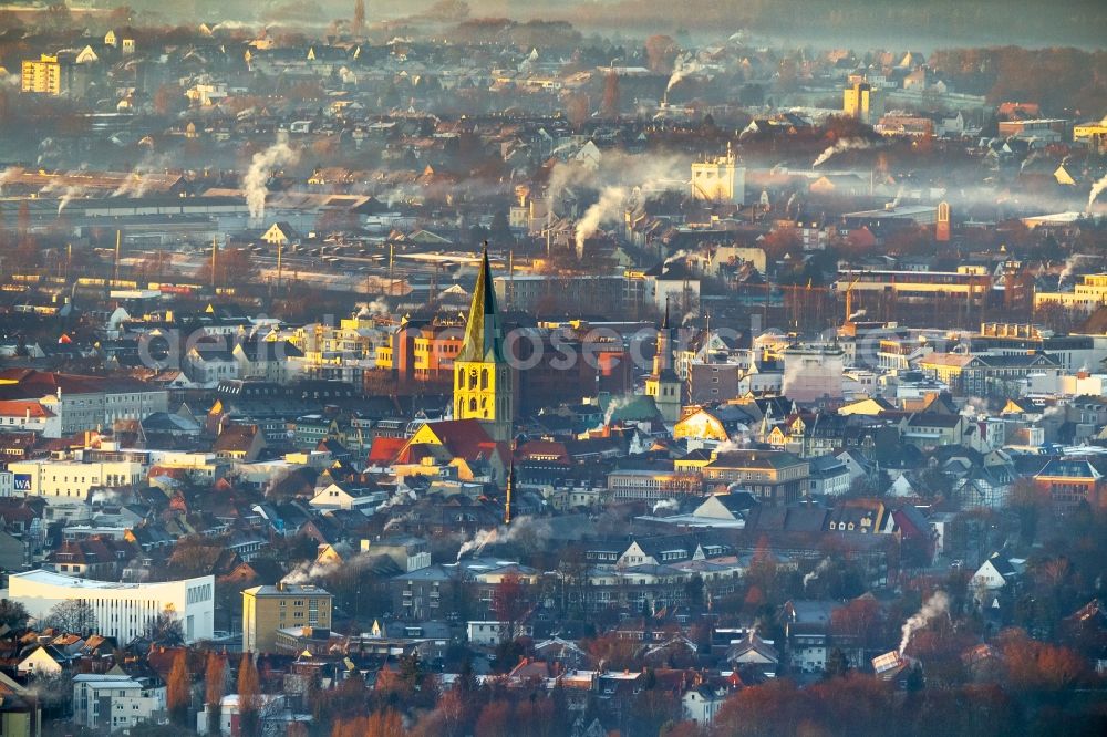 Hamm from the bird's eye view: Morning fog in the backlight over St. Paul's Church with plumes of chimneys at sunrise in Hamm, North Rhine-Westphalia