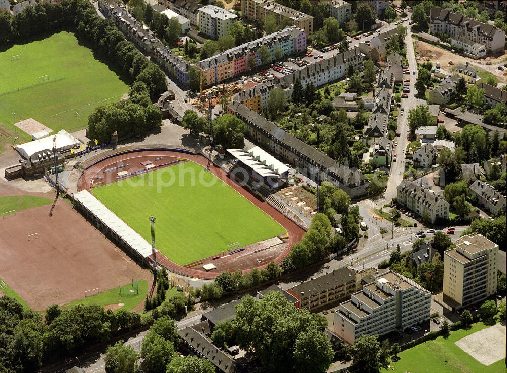 Aerial photograph Trier - Blick auf die Sportanlage am Moselstadion. Das Moselstadion wurde 1930 gegründet. Auf Grund des FDB-Halbfinalspiels wurde 1998 eine Flutlichtanlage errichtet. Genutzt wird das Stadion vom SV Eintracht Trier, der in der Saison 2003/ 04 in die zweite Bundesliga aufstieg. Seitdem wurden einige Besserungsarbeiten am Stadion vorgenommen. Die Haupttribüne wurde erweitert und ein Vereinslokal errichtet was den Anstieg der Besucherzahlen zur Folge hatte. Inzwischen ist der SV Eintracht Trier wieder abgestiegen und weitere Umbaumaßnamen wurden vorerst auf Eis gelegt. Momentan bietet das Stadion Platz für 10.254 Zuschauer wovon 8000 Stehplätze, davon wiederrum 2000 überdacht sind. 2000 weitere Sitzplätze finden sich auf der Tribüne. Kontakt: SV Eintracht Trier, Am Stadion 1 54292 Trier, Tel. +49(0)651 1467 10, Fax +49(0)651 1467 171, Email: info@sv-eintracht-trier05.de