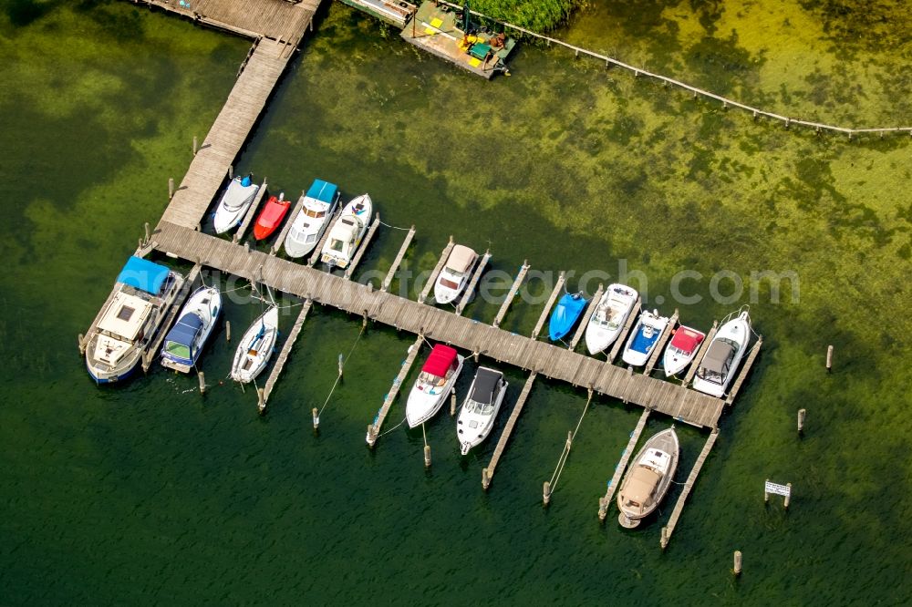 Plau am See from the bird's eye view: Motorboat marina with docks and moorings on the shore area of Plauer See in Plau am See in the state Mecklenburg - Western Pomerania