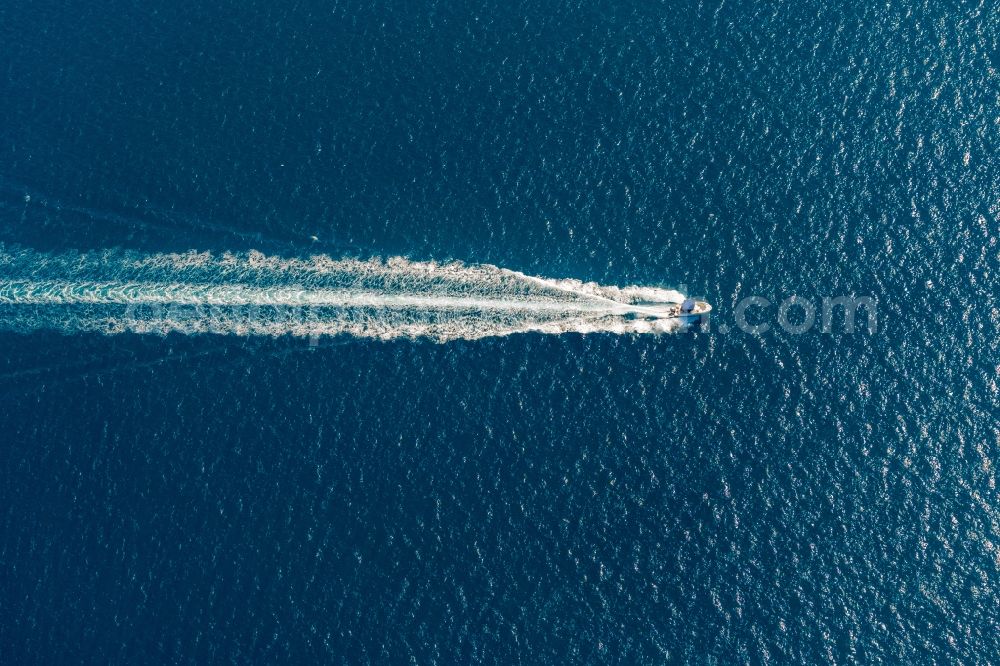 Alcudia from above - Motorboat - speedboat in motion in the bay of Alcudia in Alcudia in Balearic island of Mallorca, Spain