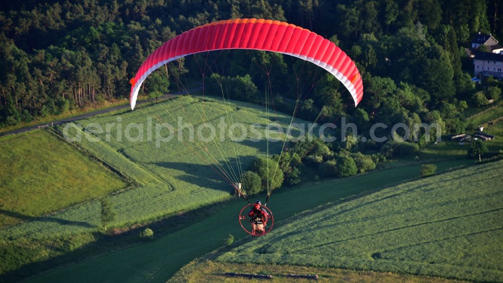 Königswinter from the bird's eye view: Motorized paraglider in flight over the airspace in Koenigswinter in the state North Rhine-Westphalia, Germany