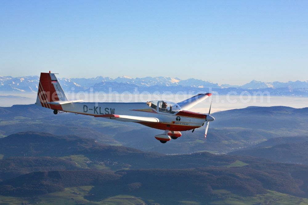 Rheinfelden (Baden) from above - Scheibe SF 25 CR Falke with callsign D-KLSW in flight in the airspace over Rheinfelden (Baden) in the state Baden-Wuerttemberg and clear views over the mountains and hills of the Swiss Jura to the Alps.