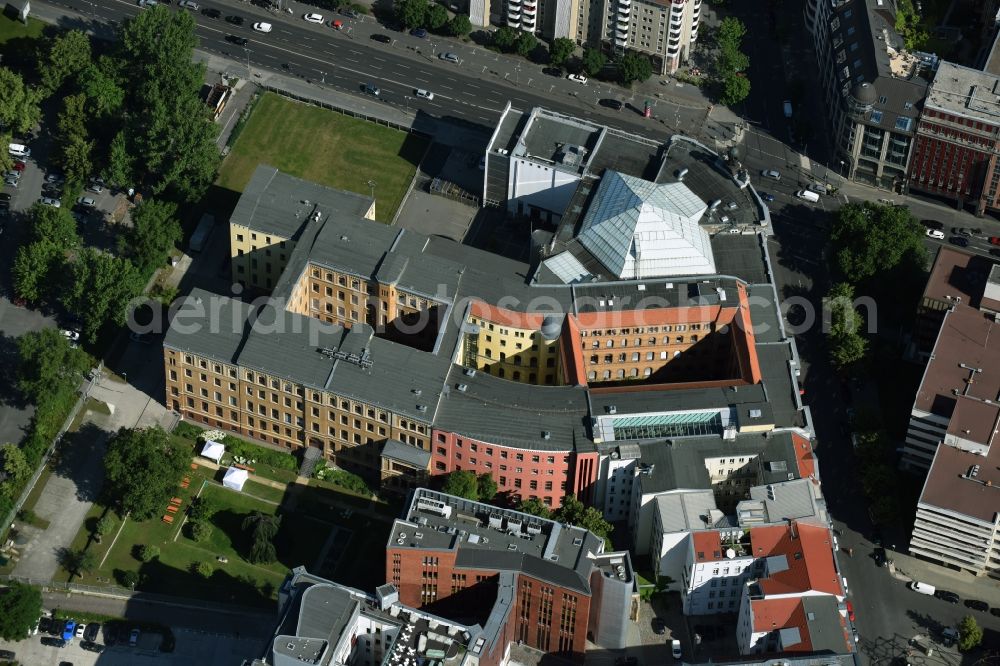 Berlin from the bird's eye view: Listed Museum of Communication at Leipziger Strasse in Berlin-Mitte is one of the sites of Museum Foundation for Posts and Telecommunications. Established as Reichspostmuseum, one of the first museums for history of technology, by Postmaster General of German Reich Heinrich von Stephan in 1872, the building got badly damaged in World War II. The planned instauration as DDR Postmuseum was carried out just partially. Only after the fall of the Wall the house was restored and finally reopened as Museum of Communication in 2000