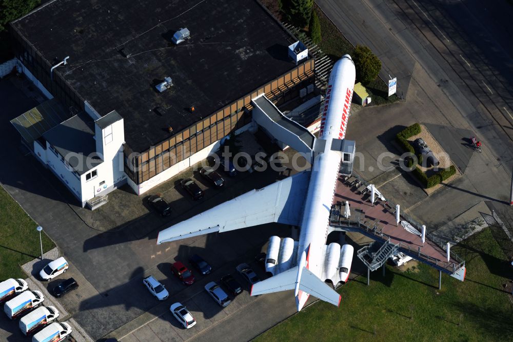 Aerial image Leipzig - Discarded Ilyushin IL-62 passenger aircraft of the former GDR - airline INTERFLUG as an aircraft with the registration DDR-SEF - used as a museum building ensemble and restaurant on Arno-Nitzsche-Strasse in the southern part of the city Leipzig in the state of Saxony, Germany