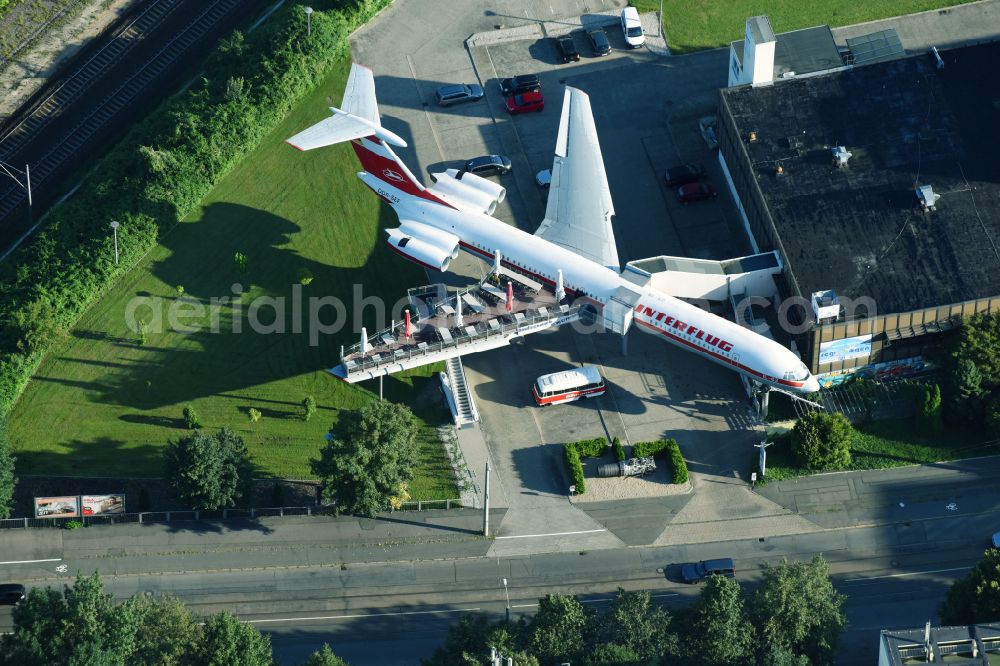 Leipzig from the bird's eye view: Discarded Ilyushin IL-62 passenger aircraft of the former GDR - airline INTERFLUG as an aircraft with the registration DDR-SEF - used as a museum building ensemble and restaurant on Arno-Nitzsche-Strasse in the southern part of the city Leipzig in the state of Saxony, Germany