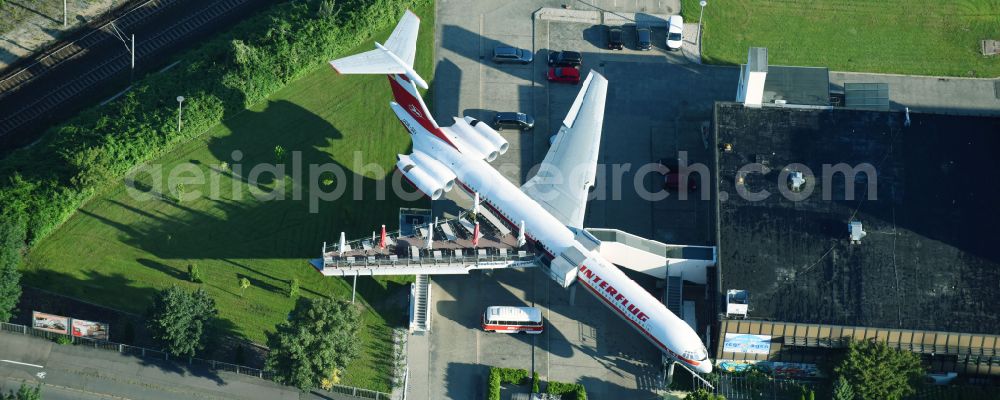 Aerial image Leipzig - Discarded Ilyushin IL-62 passenger aircraft of the former GDR - airline INTERFLUG as an aircraft with the registration DDR-SEF - used as a museum building ensemble and restaurant on Arno-Nitzsche-Strasse in the southern part of the city Leipzig in the state of Saxony, Germany