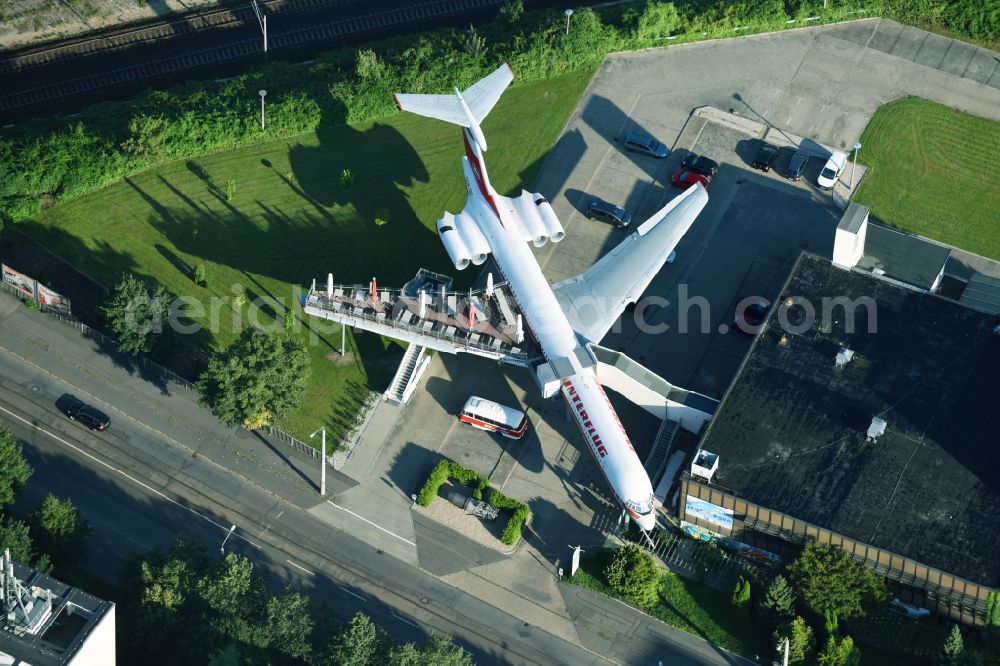 Aerial photograph Leipzig - Discarded Ilyushin IL-62 passenger aircraft of the former GDR - airline INTERFLUG as an aircraft with the registration DDR-SEF - used as a museum building ensemble and restaurant on Arno-Nitzsche-Strasse in the southern part of the city Leipzig in the state of Saxony, Germany