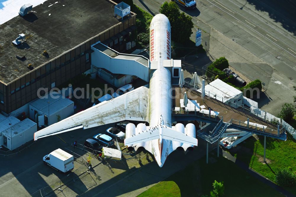 Aerial photograph Leipzig - Discarded Ilyushin IL-62 passenger aircraft of the former GDR - airline INTERFLUG as an aircraft with the registration DDR-SEF - used as a museum building ensemble and restaurant on Arno-Nitzsche-Strasse in the southern part of the city Leipzig in the state of Saxony, Germany