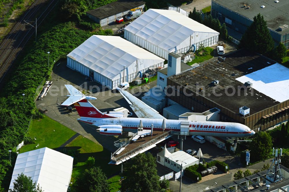 Leipzig from above - Discarded Ilyushin IL-62 passenger aircraft of the former GDR - airline INTERFLUG as an aircraft with the registration DDR-SEF - used as a museum building ensemble and restaurant on Arno-Nitzsche-Strasse in the southern part of the city Leipzig in the state of Saxony, Germany