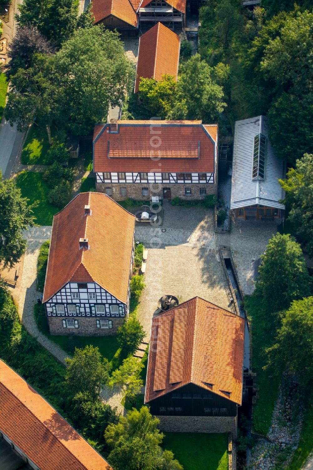 Aerial image Hagen - Museum building ensemble of the open air museum in Maeckingerbach Valley in Hagen in the state of North Rhine-Westphalia. The historic houses and buildings are located in a valley, surrounded by forest