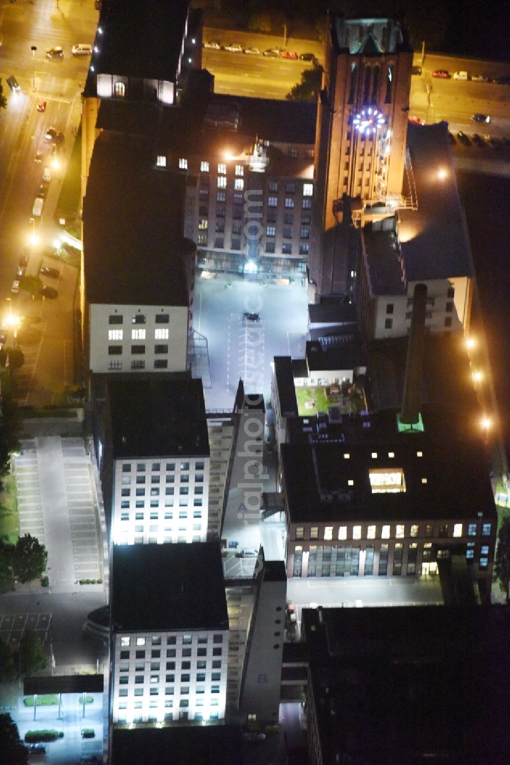 Aerial image Berlin - Night view architectural monument and building complex of the historic Ullsteinhaus at Tempelhofer Hafen Mariendorfer Damm corner Ullsteinstrasse in Berlin. The building in the style of brick expressionism is used as a medical center and company building