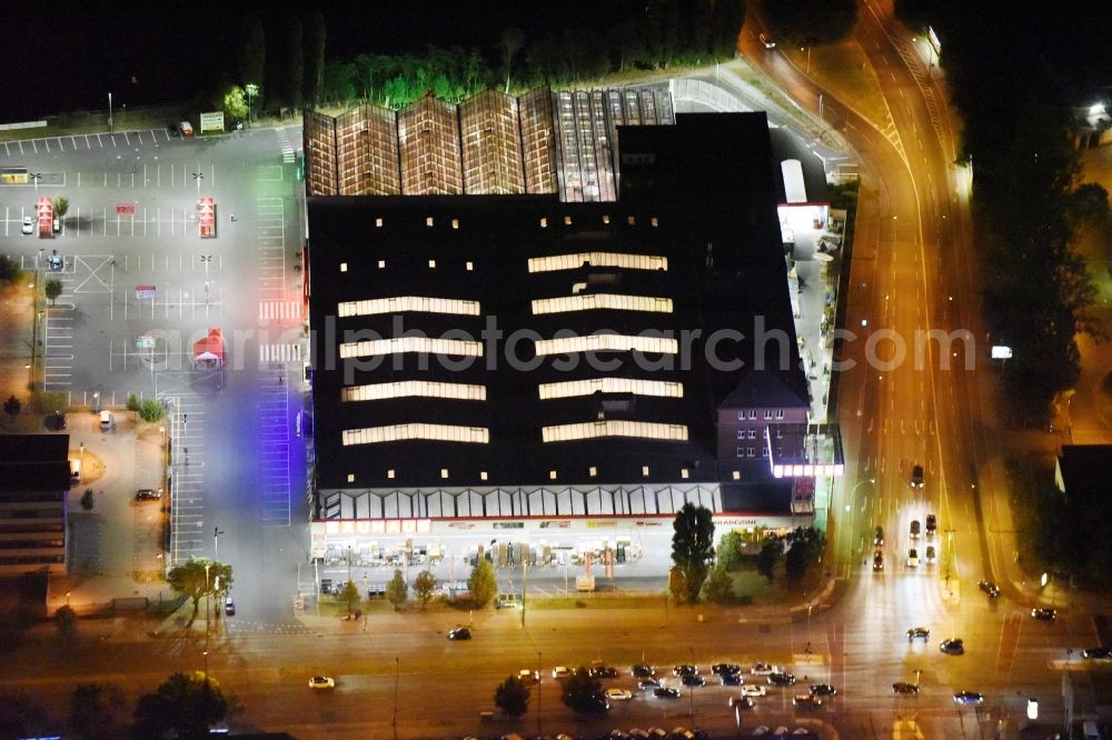 Berlin from the bird's eye view: Night view Building of the construction market Bauhaus Schnellerstrasse federal road B96a Karlshorster Strasse in Berlin