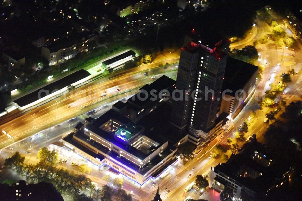 Berlin from above - Night view of the Steglitzer Kreisel, a empty building complex with an office tower in Berlins district of Steglitz