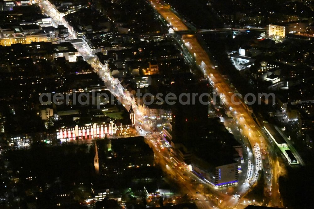 Aerial photograph Berlin - Night view of the Steglitzer Kreisel, a empty building complex with an office tower in Berlins district of Steglitz