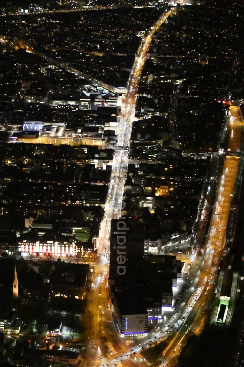 Aerial image Berlin - Night view of the Steglitzer Kreisel, a empty building complex with an office tower in Berlins district of Steglitz