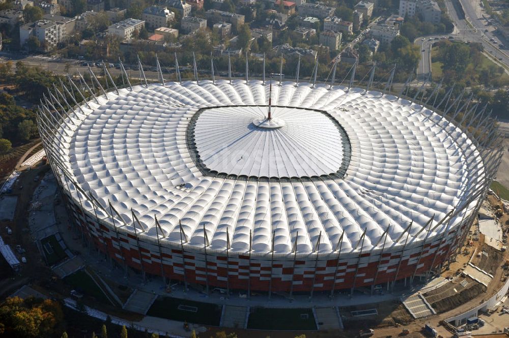 Warschau / Warszawa / Warsaw from the bird's eye view: Das neu errichtete Stadion Warschauer Nationalstadion im Stadtteil Praga am Weichselufer gegenüber dem Warschauer Zentrum in der Woiwodschaft Masowien, Polen. Das Fußballstadion ist ein Austragungsort der UEFA Fußball-Europameisterschaft EM 2012. Generalplaner des Stadion-Neubau ist ein Konsortium aus den Architekturbüros JSK Architekten, Gerkan, Marg und Partner sowie dem Ingenieurbüro Schlaich Bergermann und Partner. Die Hochbauarbeiten wurden durch die ALPINE - PBG SA und die Hydrobudowa Polska SA ausgeführt. The new built stadium National Stadium in Warsaw in the voivodeship Masovia, Poland.