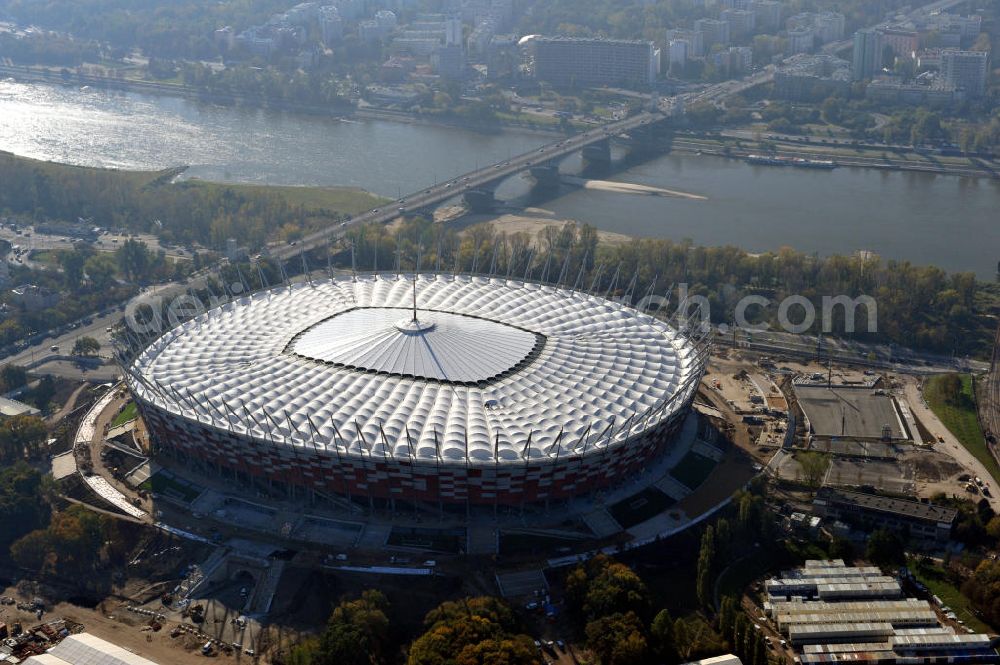 Aerial image Warschau / Warszawa / Warsaw - Das neu errichtete Stadion Warschauer Nationalstadion im Stadtteil Praga am Weichselufer gegenüber dem Warschauer Zentrum in der Woiwodschaft Masowien, Polen. Das Fußballstadion ist ein Austragungsort der UEFA Fußball-Europameisterschaft EM 2012. Generalplaner des Stadion-Neubau ist ein Konsortium aus den Architekturbüros JSK Architekten, Gerkan, Marg und Partner sowie dem Ingenieurbüro Schlaich Bergermann und Partner. Die Hochbauarbeiten wurden durch die ALPINE - PBG SA und die Hydrobudowa Polska SA ausgeführt. The new built stadium National Stadium in Warsaw in the voivodeship Masovia, Poland.