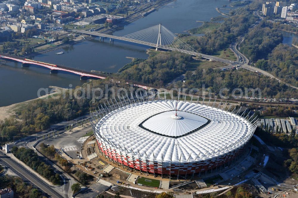 Aerial image Warschau / Warszawa / Warsaw - Das neu errichtete Stadion Warschauer Nationalstadion im Stadtteil Praga am Weichselufer gegenüber dem Warschauer Zentrum in der Woiwodschaft Masowien, Polen. Das Fußballstadion ist ein Austragungsort der UEFA Fußball-Europameisterschaft EM 2012. Generalplaner des Stadion-Neubau ist ein Konsortium aus den Architekturbüros JSK Architekten, Gerkan, Marg und Partner sowie dem Ingenieurbüro Schlaich Bergermann und Partner. Die Hochbauarbeiten wurden durch die ALPINE - PBG SA und die Hydrobudowa Polska SA ausgeführt. The new built stadium National Stadium in Warsaw in the voivodeship Masovia, Poland.