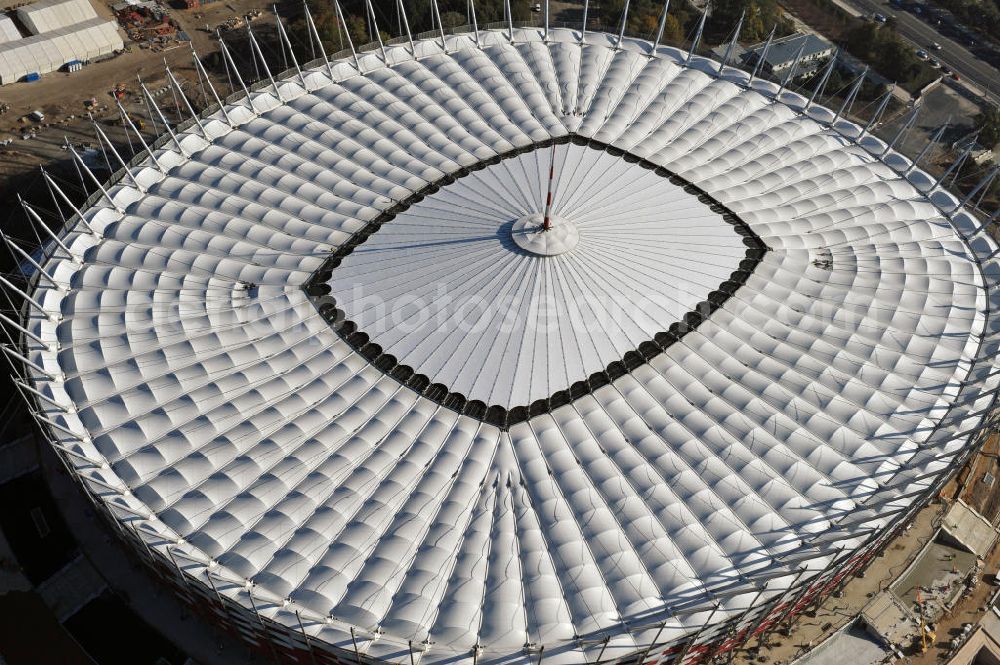 Aerial photograph Warschau / Warszawa / Warsaw - Das neu errichtete Stadion Warschauer Nationalstadion im Stadtteil Praga am Weichselufer gegenüber dem Warschauer Zentrum in der Woiwodschaft Masowien, Polen. Das Fußballstadion ist ein Austragungsort der UEFA Fußball-Europameisterschaft EM 2012. Generalplaner des Stadion-Neubau ist ein Konsortium aus den Architekturbüros JSK Architekten, Gerkan, Marg und Partner sowie dem Ingenieurbüro Schlaich Bergermann und Partner. Die Hochbauarbeiten wurden durch die ALPINE - PBG SA und die Hydrobudowa Polska SA ausgeführt. The new built stadium National Stadium in Warsaw in the voivodeship Masovia, Poland.