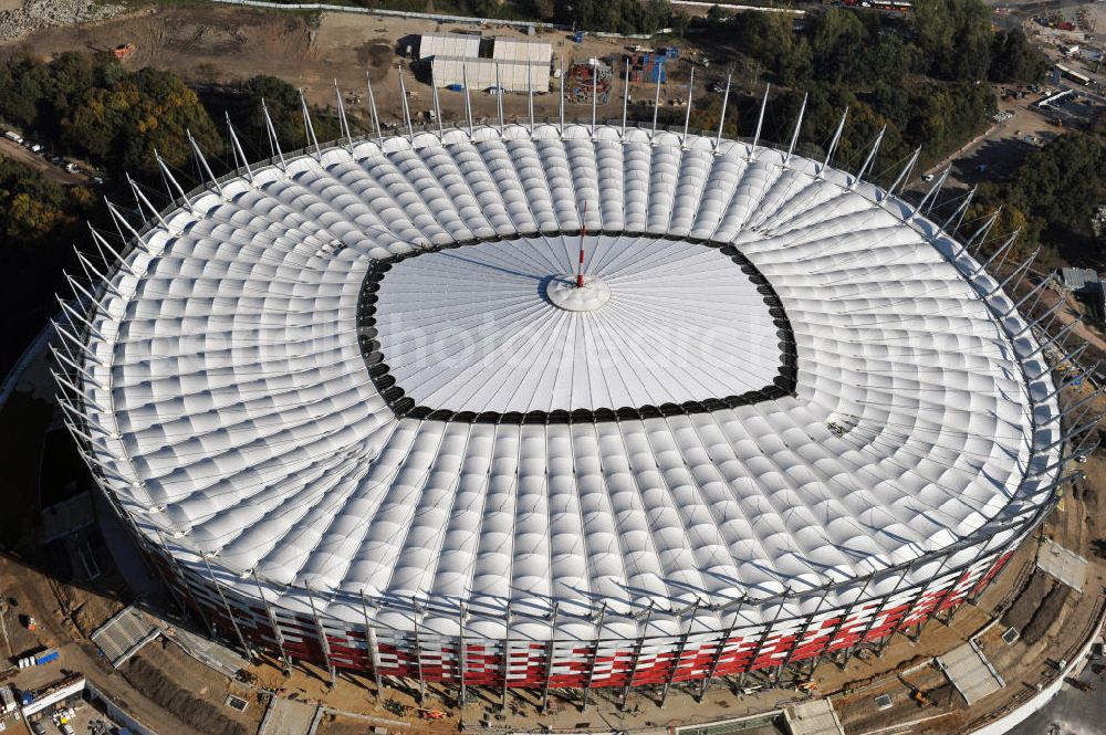 Warschau / Warszawa / Warsaw from the bird's eye view: Das neu errichtete Stadion Warschauer Nationalstadion im Stadtteil Praga am Weichselufer gegenüber dem Warschauer Zentrum in der Woiwodschaft Masowien, Polen. Das Fußballstadion ist ein Austragungsort der UEFA Fußball-Europameisterschaft EM 2012. Generalplaner des Stadion-Neubau ist ein Konsortium aus den Architekturbüros JSK Architekten, Gerkan, Marg und Partner sowie dem Ingenieurbüro Schlaich Bergermann und Partner. Die Hochbauarbeiten wurden durch die ALPINE - PBG SA und die Hydrobudowa Polska SA ausgeführt. The new built stadium National Stadium in Warsaw in the voivodeship Masovia, Poland.