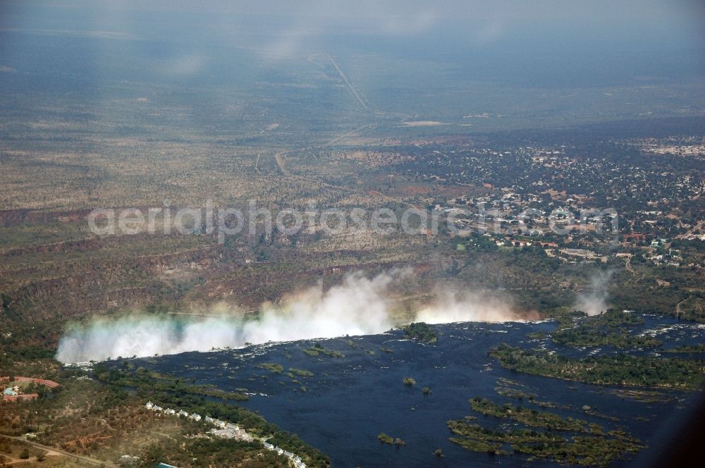 Victoria Falls from the bird's eye view: Natural spectacle of the waterfall in the rocky landscape on sambesi river in Victoria Falls in Matabeleland North Province, Zimbabwe