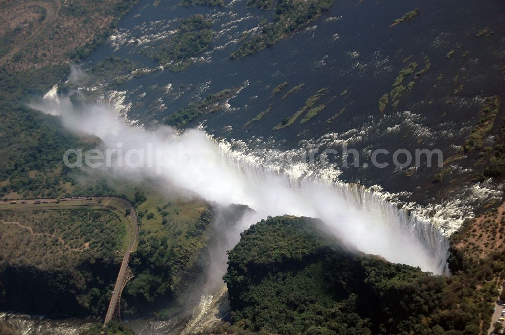 Victoria Falls from the bird's eye view: Natural spectacle of the waterfall in the rocky landscape on sambesi river in Victoria Falls in Matabeleland North Province, Zimbabwe