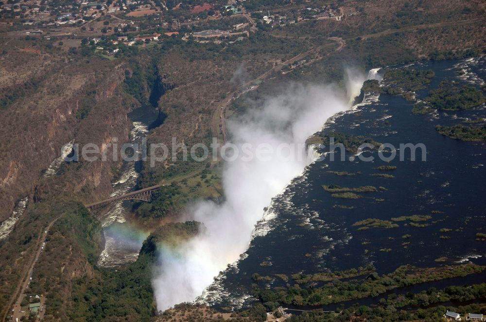 Aerial photograph Victoria Falls - Natural spectacle of the waterfall in the rocky landscape on sambesi river in Victoria Falls in Matabeleland North Province, Zimbabwe