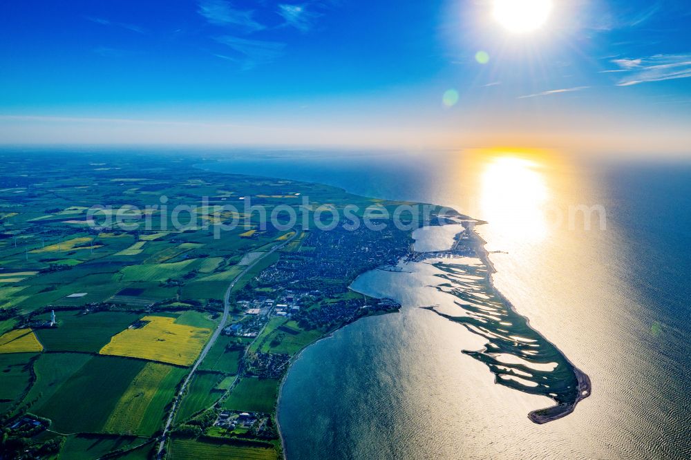 Aerial photograph Heiligenhafen - Sandy beach landscape along the coastline on the shore of the Baltic Sea with houses and buildings of the Nature Reserve & NABU Center Graswarder on the street Graswarderweg in the district of Graswarder in Heiligenhafen on the Baltic Sea coast in the federal state of Schleswig-Holstein, Germany