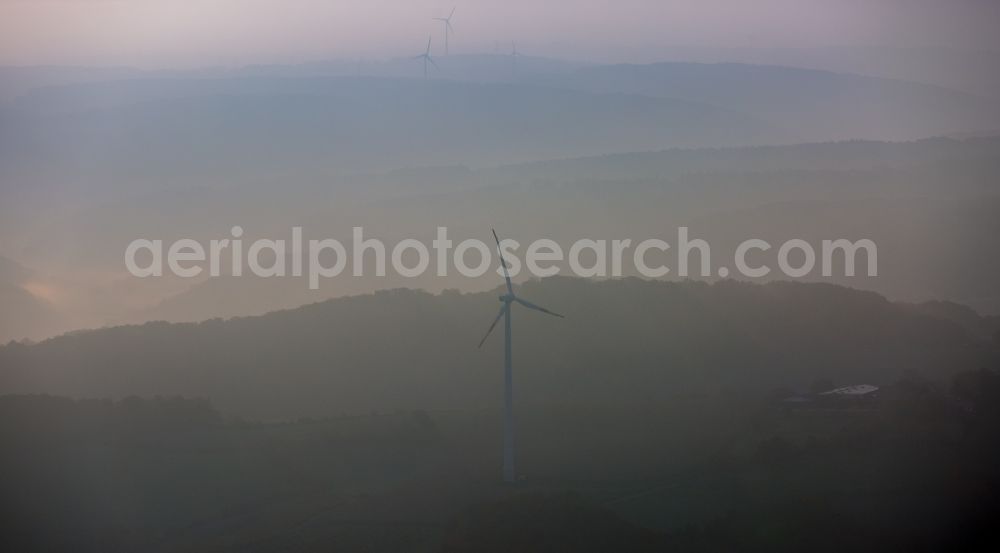 Byfang from the bird's eye view: Fog and autumn above a hill with wind turbines near Byfang in the state of North Rhine-Westphalia