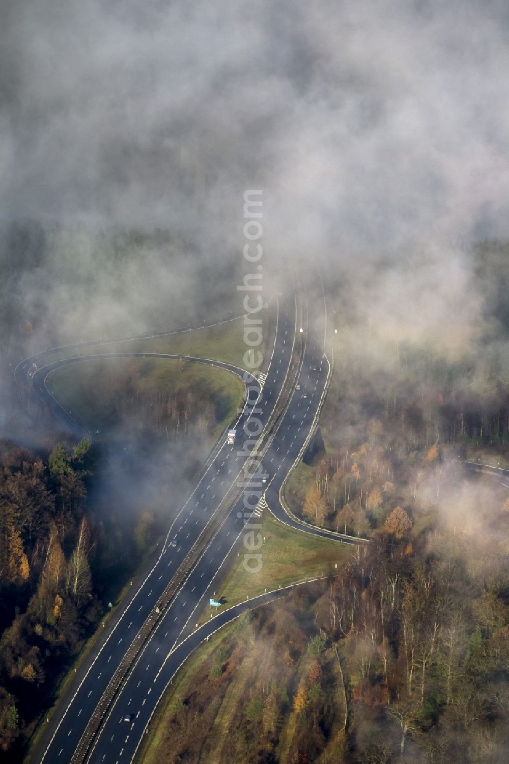 Arnsberg from the bird's eye view: Fog and low-lying clouds Fields with sight obstruction to the motorway Autobahn A46 near Arnsberg in North Rhine-Westphalia