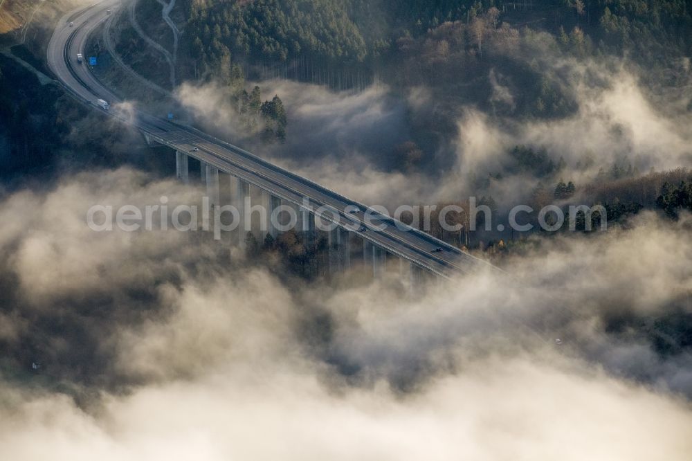 Arnsberg OT Oeventrop from the bird's eye view: Fog surrounded motorway bridge on the motorway Autobahn A46 at Oeventrop - a district of Arnsberg in the Sauerland region in North Rhine-Westphalia