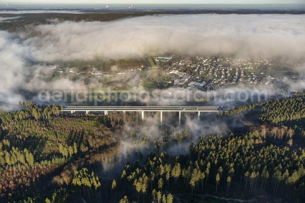 Arnsberg OT Oeventrop from the bird's eye view: Fog surrounded motorway bridge on the motorway Autobahn A46 at Oeventrop - a district of Arnsberg in the Sauerland region in North Rhine-Westphalia