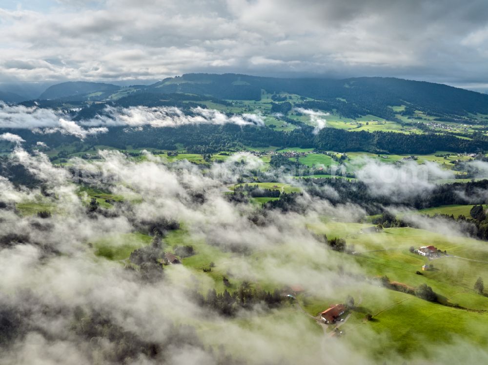 Aerial photograph Irsengund - Weather related fog banks and cloud layer over forest and meadow landscape in Irsengund allgaeu in the state Bavaria, Germany