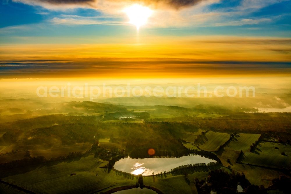 Malente from the bird's eye view: Sunrise Due to the weather conditions overlying fog banks and layer of clouds in Holstein Switzerland Malente GrosserBenzer lake in the state Schleswig-Holstein, Germany