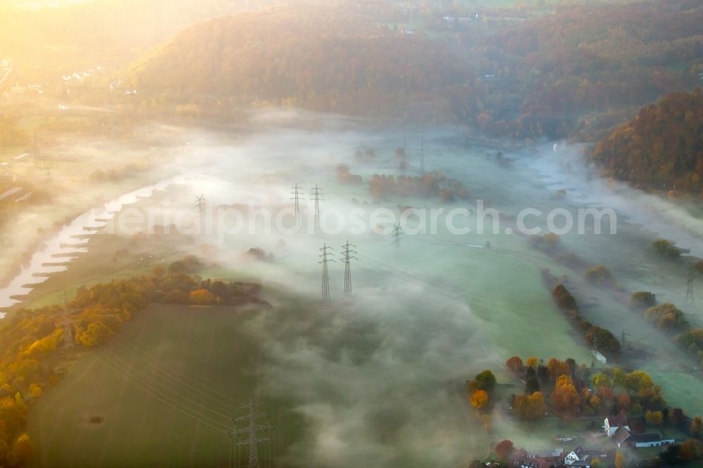 Hattingen from the bird's eye view: Fog cloud layer at current route of the power lines and pylons in Hattingen in the state North Rhine-Westphalia