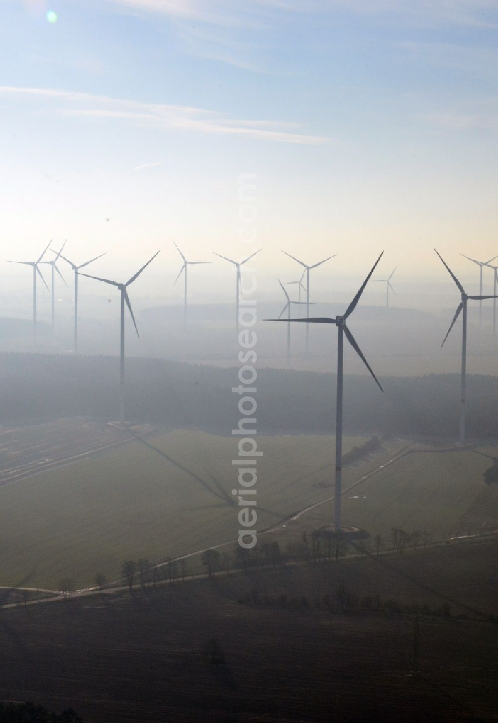 Aerial image Werneuchen - Fog landscape with rotors of wind turbines of a wind power plant in Werneuchen in Brandenburg